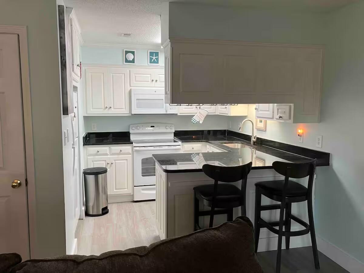 TREASURE COVE CONDOMINIUM UNIT D-103 ORB 980 P 492 1BR 1B 656 H&C ORB 4719 P 2364 - Residential