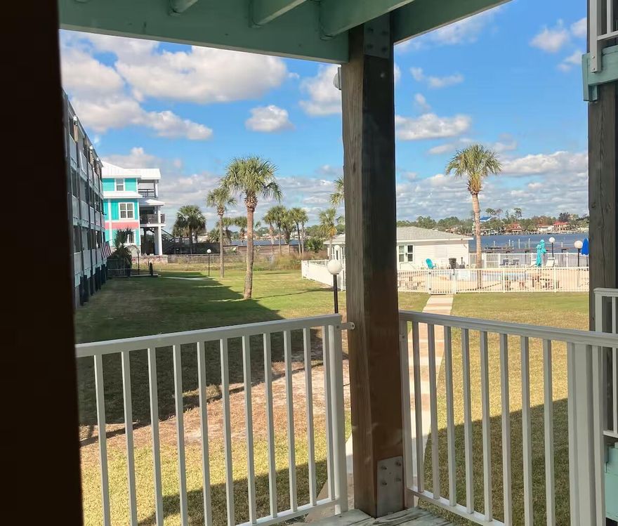 Unit D-103 at 3600 Thomas Drive is a 1-bedroom, 1-bath condo on the first floor of Treasure Cove in Panama City Beach. With 656 sq ft, it features a full kitchen, central AC, and in-unit washer/dryer. Enjoy a private balcony overlooking the pool and Grand Lagoon. Treasure Cove offers an in-ground pool, boat dock, clubhouse, BBQ area, and pet-friendly living. HOA includes water, sewer, trash, cable, pest control, and pool upkeep. Short-term rentals are allowed, making it great for full-time living or investment.