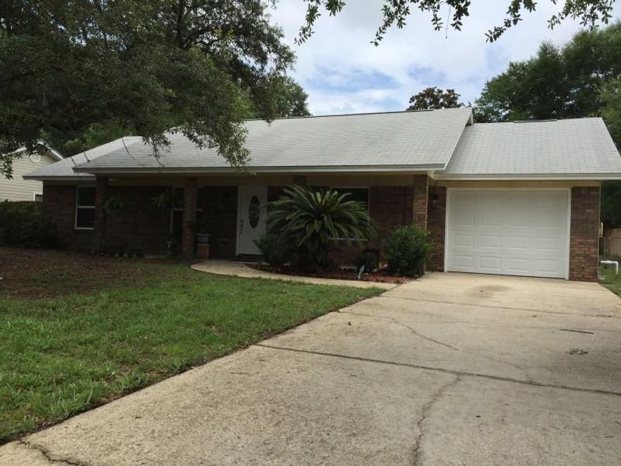 A New, New, New find in a sea of older, tired and dated homes!!!! This freshly renovated 3 bedroom, 2 bath home centrally located in Fort Walton Beach, FL has new porcelain tile flooring in all areas except the bedrooms which have plush new carpeting. There are new windows, new doors (Interior & Exterior), new kitchen cabinets, new granite counter tops with an awesome tile backsplash and never-used new stainless steel appliances. The home is freshly painted throughout and sits on a large beautiful lot with gorgeous trees, a big spacious fenced backyard and a new well pump connected to a 4-zone irrigation system already working to keep things green!! Plus a single car garage that's one of the few in the area actually large enough to park in with 11 1/2 feet of width