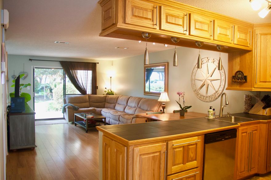 BACK ON THE MARKET! Recently appraised. Buyers financing fell through. This spacious 1466 sq. ft. townhouse is a 2 bedroom 2.5 bath with a bonus room and is one you don't want to miss - located in Magnolia Bay Club. There is new carpet, fresh paint and some new fixtures and is one of only 6 attached town homes surrounded by nice landscaping and mature magnolias. It also features a recently updated kitchen with stainless steel appliances, an open floor plan with a living/dining area with wood laminate throughout out the first level. A sliding glass door leads you out onto a patio to your own tropical oasis for outdoor cooking or just relaxing. The next level boast 2 master suites with full baths. There is a large bonus room that has its own heating and cooling system that could be used as an office, guest room or extra storage area and is located on third floor.

Take the scenic back road to avoid 98 summer traffic. Come take a look at this - you will not be disappointed. Owner/Agent is a State of Florida Licensed Real Estate Agent. Buyer to verify all data, details and information important to them.