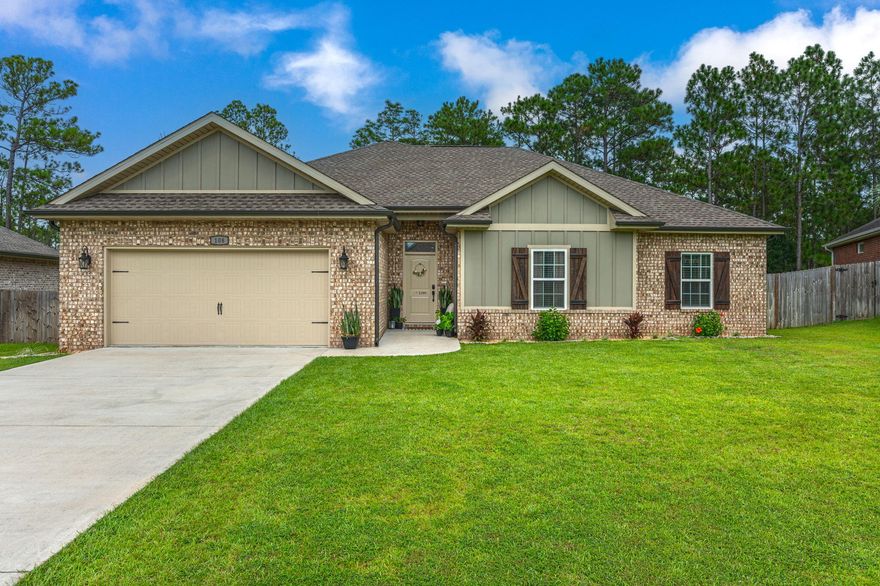 **SELLER WILL PAY TWO POINTS FOR BUYERS RATE BUY DOWN** Absolute stunner - this 2019 built home is loaded with beautiful finishes and upgrades. Located conveniently in South Crestview, this property is an easy commute to all area bases and the local beaches and features one of the largest lots in the neighborhood, nearly a half acre! The open floor plan and raised ceilings provide for a functional flow through the main living areas and kitchen. Kitchen features granite countertops and newly updated backsplash. Carpeted floors are only found in the bedrooms, with laminate and tile flooring throughout the main areas and bathrooms. Master suite features HUGE walk-in closet and raised ceilings, with large en-suite housing tiled walk-in shower, garden tub, and double vanities. This home has been *meticulously* maintained and pride of ownership abounds throughout. Additional notable interior features include crown molding, barn door, and custom trimwork. The backyard does not disappoint, with a large fenced-in backyard and covered deck- perfect for entertaining. Whole house gutters, 5 zone irrigation system, and an oversized 2 car garage further add to the appeal of this newer construction home. Be sure to schedule your showing today!