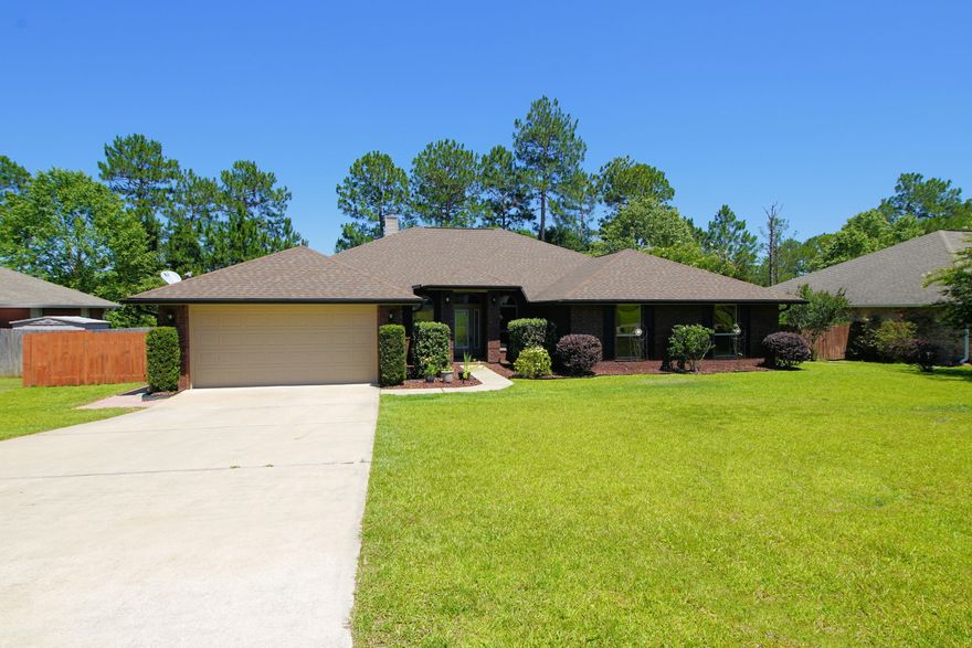 Room for everyone in this spacious 5-bedroom 2.5 bath brick home located in a quiet neighborhood just south of I-10. Elegantly appointed living room with arched entry, bullnose corners, raised ceilings, woodburning fireplace with raised hearth. Huge open kitchen with stainless appliances, kitchen island, tons of cabinets and counter space, large pantry and breakfast bar. Bonus room off the kitchen with French doors that open to the 25 x 12 covered porch. Formal dining room next to the kitchen. Popular wood-look tile floors throughout the main living area, tile in the kitchen and carpeting in the bedrooms. Convenient mud room/laundry area off the garage with enough room for a full sized washer and dryer plus and extra area for added storage. Contingent contract accepted, back-ups are welcom