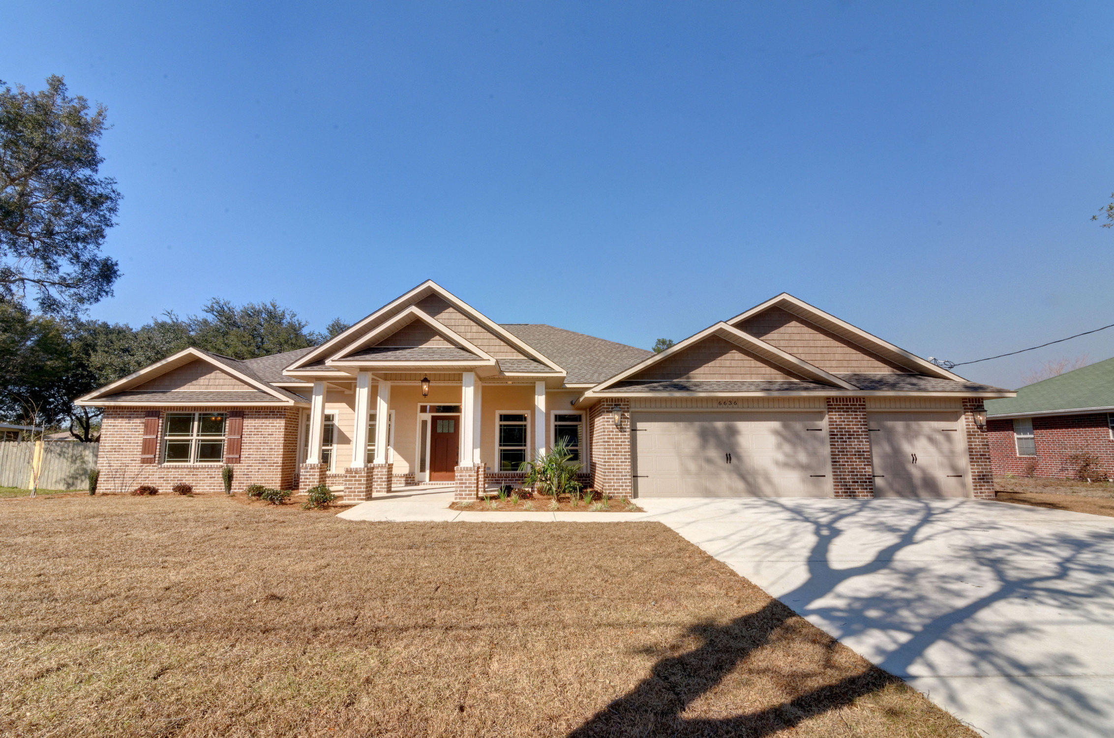 To BE BUILT! This is an all brick 5 Bedroom, 3 full Baths, 2757 square foot home in Holley by the Sea. Enjoy all of the amenities of the Club House, pool, tennis courts, gym, game room, waterfront park, access to Santa Rosa Sound and East Bay. This split floor plan home features a spacious great room, formal dining room and a large kitchen with granite counter tops, stainless appliances, smooth top stove, and a built-in microwave and dishwasher. The home has tile floors in all wet areas, hardwood floors in the formal dining room and carpeting in the great room and all bedrooms. The master bath features: a large shower, jetted garden tub, double granite vanity, tile floors and two large walk-in closets. There is a 16 x 10 covered porch on the back of this home.