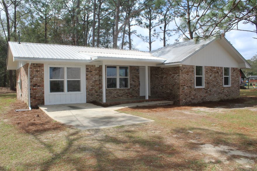 BACK ON THE MARKET.....REDUCED PRICE! Beautifully remodeled brick home, nestled on a generous half-acre+ lot offering the perfect blend of modern updates & timeless charm. With 3 bedrooms, 2 full baths & 1,524 square feet of living space, this home is designed for comfortable living. As you step inside, you'll be greeted by fresh, contemporary finishes throughout including BRAND NEW windows in every room & BRAND NEW flooring....NO carpet here! The spacious living areas feature new light fixtures & a bright, inviting atmosphere. The fully updated granite kitchen boasts brand-new appliances offering the perfect space for culinary creativity. Both bathrooms have been completely transformed with modern touches & this 'beauty' offers practical updates including a 6 year-old metal roof,  new hot water heater & 6-year old HVAC system for year-round comfort! One of the standout features of this home is the expansive BONUS ROOMideal for a home office, playroom or media center offering flexibility to suit your needs. Home is also in X Flood Zone requiring no flood insurance. Don't miss out on the opportunity to own this turn-key/"like new" home where style, function and location come together perfectly. Schedule your private tour today!