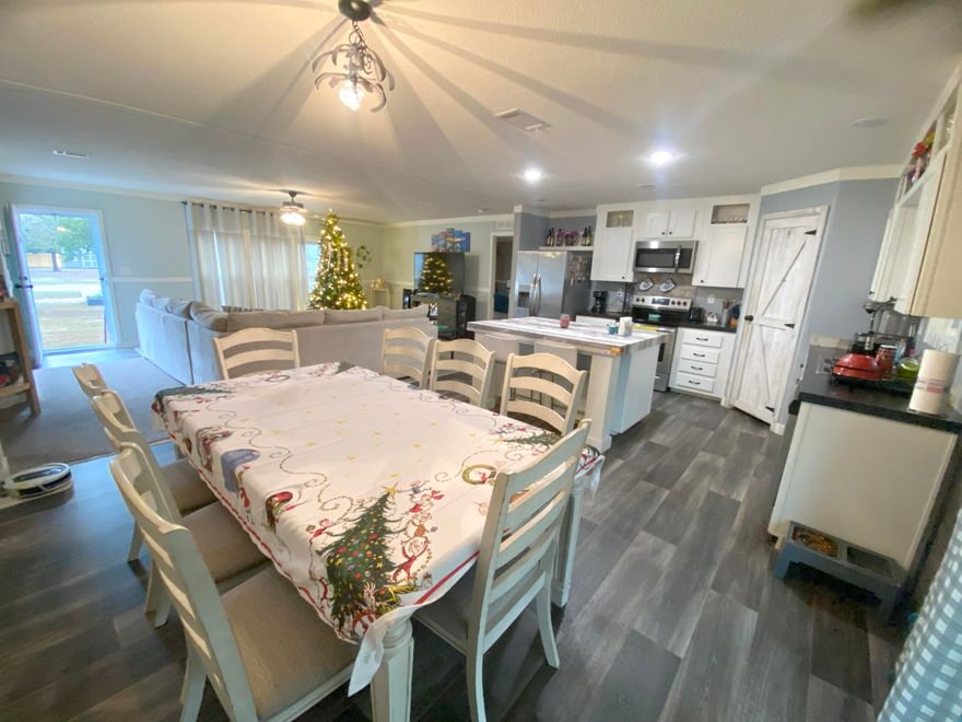 Open House this Sunday 12-2Discover this nearly new, stunningly large modular home, perfectly blending serene country living with unparalleled convenience. Situated on over an acre of pristine, cleared land, this property offers the space and tranquility you've been dreaming of, all less than half a mile from Highway 90. Step inside to find a meticulously designed interior boasting well-appointed finishes throughout. The spacious, open floor plan features modern amenities and elegant touches that create a warm, inviting atmosphere for both everyday living and entertaining. Outside, the expansive grounds provide endless possibilities, from gardening to recreation. Pet owners will delight in the large, pre-installed dog run.