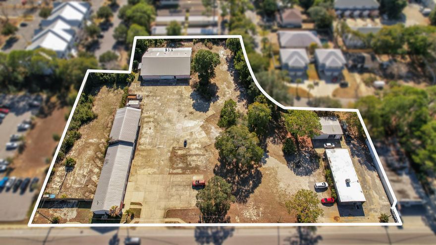 Presented for your consideration is this rare legacy property assemblage consisting of seven combined parcels located at 16 and 20 Hollywood Boulevard in the southeast area of Fort Walton Beach, Florida, totaling approximately 2.76 acres with over 400 feet of frontage along Hollywood Blvd and additional rear access from Park Cir/Park Pl. The site is strategically positioned less than one mile from U.S. Highway 98 and approximately one-third of a mile from Eglin Parkway's primary commercial corridor, providing excellent visibility and access. Improvements include four buildings totaling approximately 13,513 square feet, featuring multiple auto service bays, storefront/shop space, warehouse and storage buildings, lobby and office areas, and a large privacy-fenced laydown yard of approximately .41 acres, ideal for outside storage or parking. Zoned MX-2 (Mixed-Use High), the property has supported long-standing local businesses for decades; the former Tona's Auto Center facilities are now vacant, while Haudini Upholstery remains in operation. The assemblage is well-suited for an owner-user seeking to occupy a portion of the property while benefiting from in-place rental income from the remaining leased buildings, offering a compelling combination of operational scale, income generation, and future redevelopment potential within a high-demand corridor.
