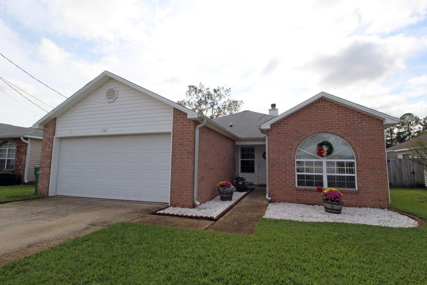 GIVE THE GIFT YOUR FAMILY DESERVES! Fantastic well maintained home situated in a private neighborhood with no through traffic. Spacious living room with trey ceilings, new vinyl plank tile flooring and a fireplace with mantle for those cozy winter nights. Dining area opens into the living room and the kitchen making entertaining a breeze. Light and bright kitchen with lots of cabinets and counter space, pantry and tile flooring. Florida room off the dining area could also be used as an office has access to the deck and backyard perfect for grilling out. Master bedroom suite has a private bath with double vanities and a walk-in closet. Split floor plan allows additional privacy from children and guests. Two additional bedrooms and a full bath complete this perfect package.