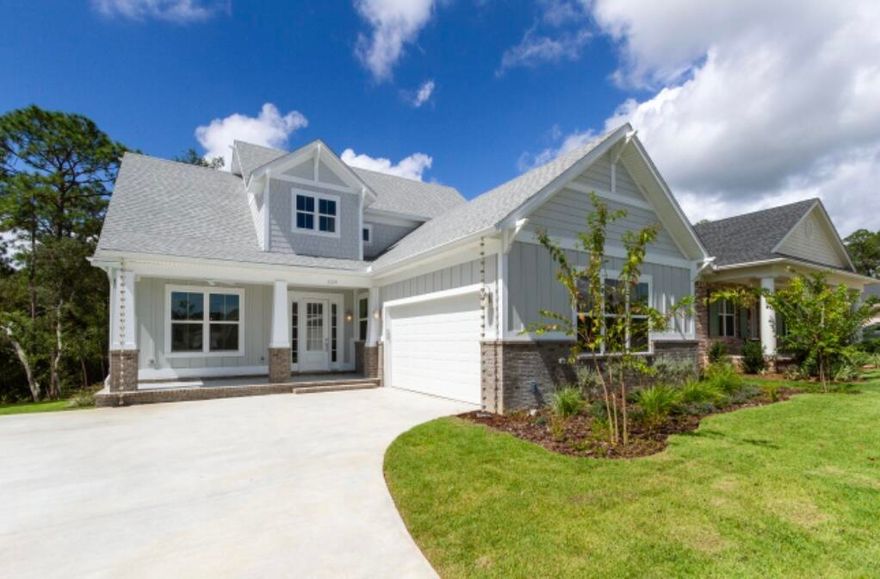 This Deer Moss Creek Designer Home is located on the nature trail with wooded preserve to the rear! You will love the dedicated office, 4 bedrooms, 3 full baths and 2 half baths which includes a powder room and a Jack-n-Jill bath boasting separate toilets and sinks with a shared tub/shower. The 2nd floor loft with wet bar and built-in daybed provides a peaceful hideaway. This home features custom built cabinets with Dolomite and Carrara Quartz countertops; GE appliances; barn door to the 1st floor office; custom closet shelving throughout; High-end LVP flooring; on demand tankless circulating gas water heater; all exterior walls and roof are spray foam insulated including the garage; interior walls have R11 Quiet Zone batts and the subfloor is insulated as well for significant energy.