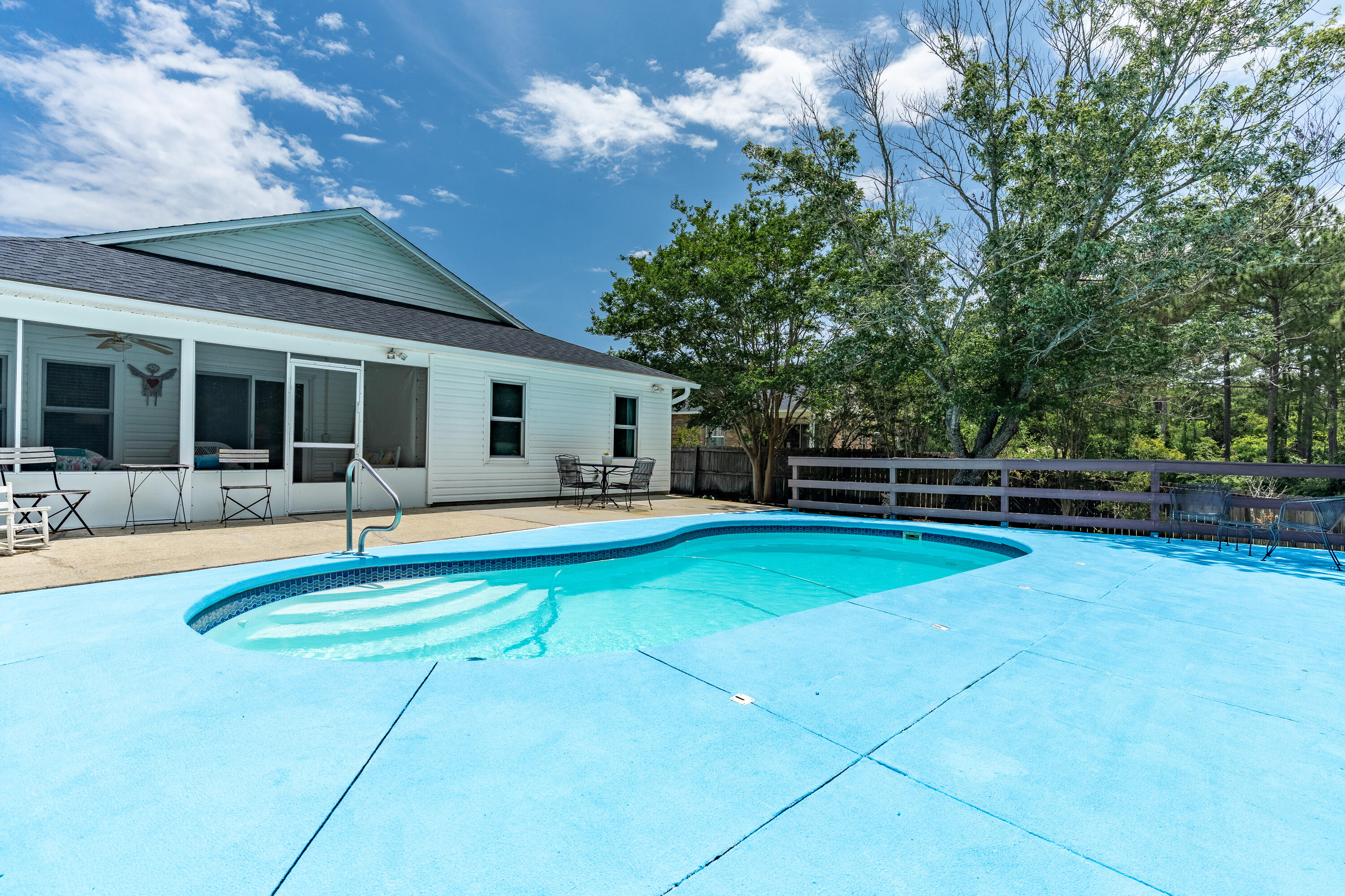 Own a slice of paradise in this functional 4-bed, 3-bath Florida oasis, designed for comfort, convenience, and relaxation. Nestled in a prime location just minutes from pristine beaches, military bases, and highly rated schools, this home offers the perfect blend of Florida livin' and accessibility. Step inside to find spacious living areas bathed in natural light, flowing into a well appointed kitchen and dining space. Retreat to the serene master suite, with private access to the pool. 3 additional bedrooms provide ample space for family, guests, or a home office. Outside, your private getaway awaits--a sparkling in-ground pool surrounded by lush landscaping, perfect for soaking up the Florida sunshine. Whether entertaining or unwinding, this backyard is designed for the Florida lifestyle. Roof 2020 - upgraded impact windows - HVAC 2018