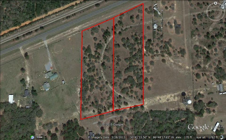 A beautiful partially wooded tract located just inside Santa Rosa County on Hwy. 90. This is a great place for a home and a place for horses too.!