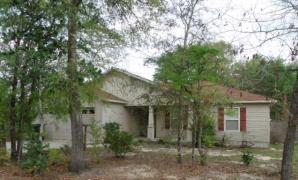 Wonderful 3 bedroom, 2 full bath home located in a cul-de-sac. Walking distance to Walton High School. This home has a very large level lot with back yard privacy fencing, covered back patio and front covered porch. Open floor plan with large living room and a great kitchen with dishwasher, built in microwave, electric stove/oven and two pantries. Master suite with double vanity sink and tub/shower combo. Garage is 26x 20 with pull down stairs and auto garage door openers. Underground utilities and Sprinkler system to keep the yard looking great!