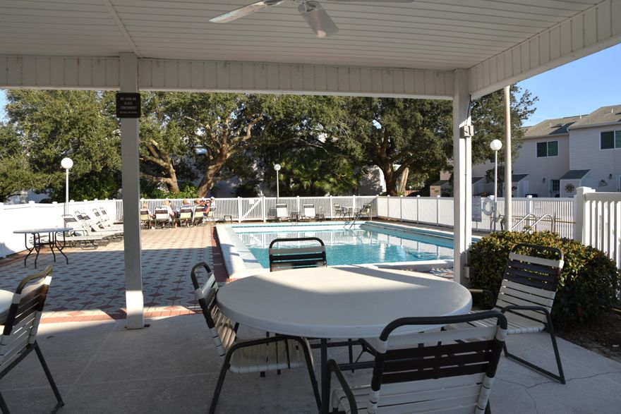 This pristine coastal retreat in Miramar Beach is steps to one of the Gulf's most beautiful beaches on Scenic Hwy 98 and Pompano Joe's vibrant eatery!  This low maintenance, two story end unit townhome sits across from the Woodland Shores community pool. It's outdoor living area features a welcoming front porch space to sit and relax and a rear patio ideal for gilling with a storage closet. Inside, there are 2 bedrooms and 2 and a half baths in the well-designed layout making it ideal for a primary, secondary, or a vacation rental property. It's rental ready with a few exclusions. The character of the townhome includes a dowstairs living area, dining, kitchen, half bath and laundry closet. Upstairs features the master with ensuite and balcony and a bedroom with ensuite plus bunk beds also