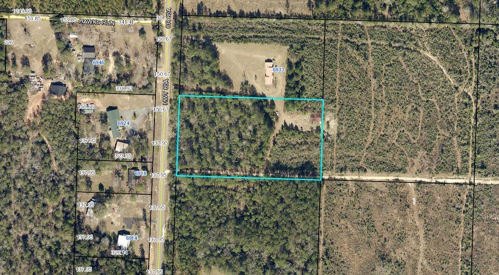 BACK ON MARKET!!! GREAT FUTURE HOME SITE! Wonderful and private, look no further than this 5 acre wooded parcel with a large barn offering you quiet country living not far off the beaten path! Bring your plans and don't miss out on this private piece of property between Crestview & Laurel Hill! Barn sold AS-IS. All measurements approximate. Buyer to verify all information deemed important. BRING US AN OFFER!
