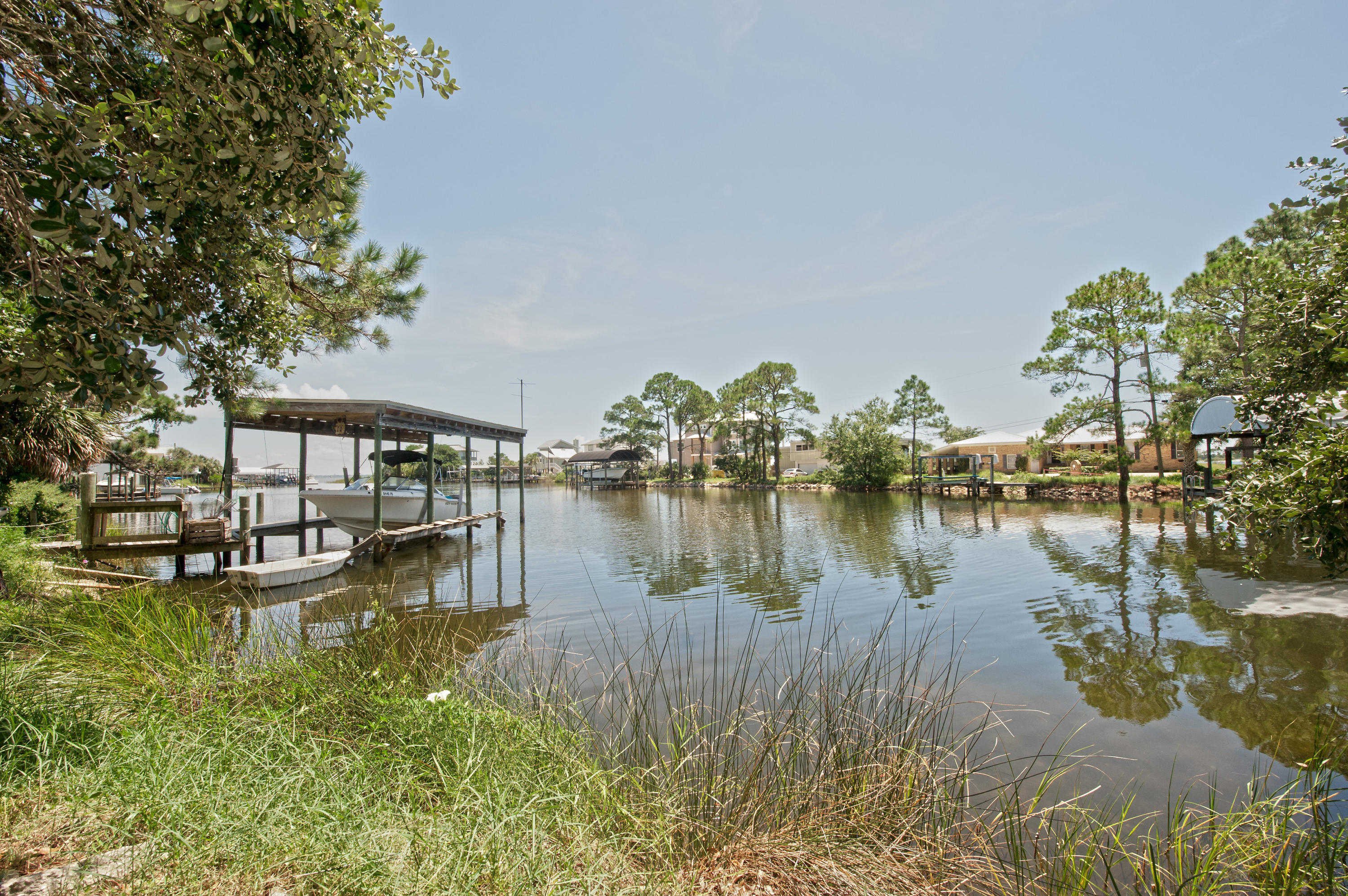 Waterfront under 500K! Situated in the very heart of Fort Walton Beach, 203 Gilmore Court comes with charm, history and sought after water access right off of Brooks Street and steps from downtown Fort Walton Beach. This original owner occupied home was built keeping the integrity of some of the oldest oak trees in Fort Walton in mind. 3 bed 2 bath, lots of living space indoors and outside, incredible natural light, high ceilings and endless potential to for a new waterfront home owner. There is deep water access that delivers you right to the Choctawhatchee Bay. 203 Gilmore is truly a rare waterfront opportunity. Schedule your private showing today!