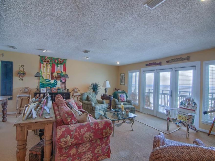Fun, Sun, Sand & Serenity, this beach townhouse has it all and then some!Beach front gulf views from all three balcony deck levels with plenty of outside living! Plus direct access to beach from stairs. Unit sold furnished with some exceptions (items with green dots) see Document Tab. The main living area is open to maximize the views. The kitchen area is spacious with granite counters, an island with a breakfast bar plus stainless steel appliances. The master bedroom is large with a beamed vaulted ceiling and a bonus loft area above. The first level has a 2 car garage and a large studio bedroom. This Studio has its own washer/dryer hook up (washer NOT warranted). Studio is plumbed for a future Kitchenette. PER Seller Replaced; Roof 2010 AC Downstairs 2017 Upstairs 2018 Deck Beachside