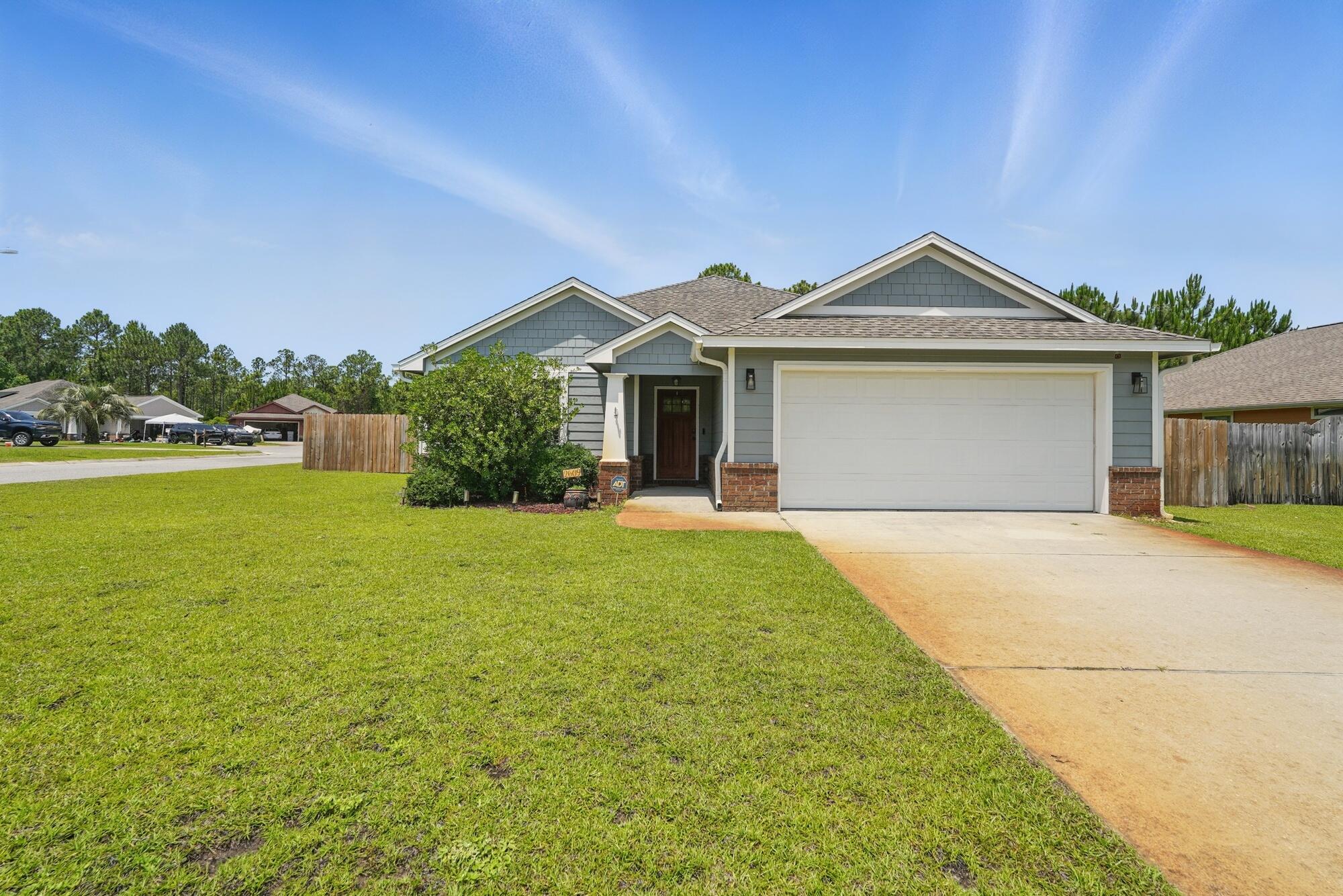 Charming, quiet, and highly desirable neighborhood in East Navarre! This beautifully maintained Conner Lot 3-bedroom, 2-bath home offers an open floor plan with granite countertops, stainless steel appliances, and tile flooring in the kitchen and dining areas.Enjoy Well-maintained carpet install 2 years ago, adding extra comfort to the bedrooms and living space. The spacious master suite features tray ceilings, a large walk-in closet, and a Fully Renovated Bathroom with a walk-in shower and double vanity.Step outside to a screened-in back porch and enjoy the privacy of a fenced backyard with nature view. Perfect for relaxing evenings.Conveniently located just minutes from the beach, shopping, Hurlburt Field this home is the perfect blend of comfort and convenient.