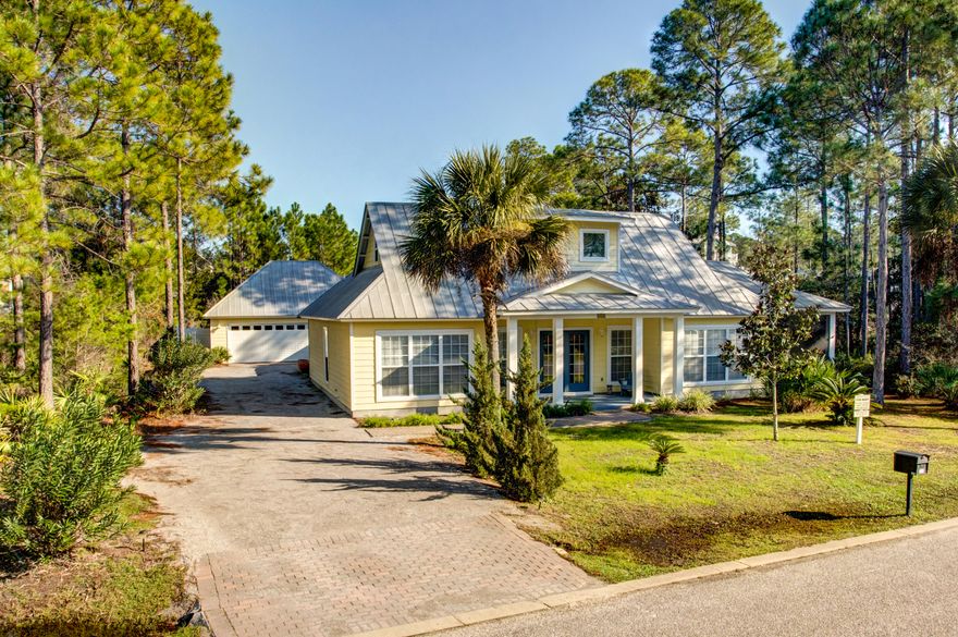 Charming cottage nestled in the woods just 1900 feet from South Walton's gorgeous beach! Includes a two-story main house, separate studio apartment, garage, and pool-making it great for families or as an income-producing property!The main house features an open-floor plan living/dining room/kitchen area with attractive tile floors and full-length windows to let in lots of natural light. Or enjoy being even closer to nature via the fully screened porch with room for both dining and relaxing. The kitchen includes an island with breakfast bar, stainless appliances, and granite countertops. The 3 bedrooms and 3 baths of the main house give a variety of options: the main floor bedroom with ensuite bath could be the master, or the entire 2nd floor could be a dedicated master...