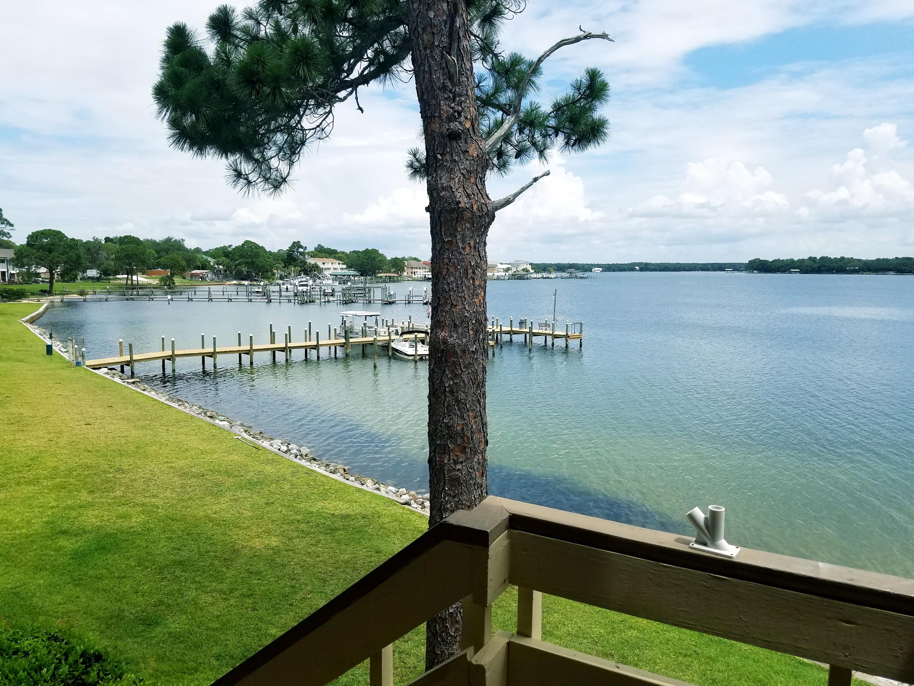 Welcome to Bayview Waters! This is an end unit on the second floor with 2 bedrooms and 2 full bathrooms with amazing views of the bay! Tile throughout with carpet in one bedroom. Spacious open concept with views from Kitchen, Living room, Master bedroom, and front and back entrance. Boat slips are available! Other amenities include laundry facility, pool, grill stations, and a dock. This is a very well kept condo and at a killer price! This one wont last long!