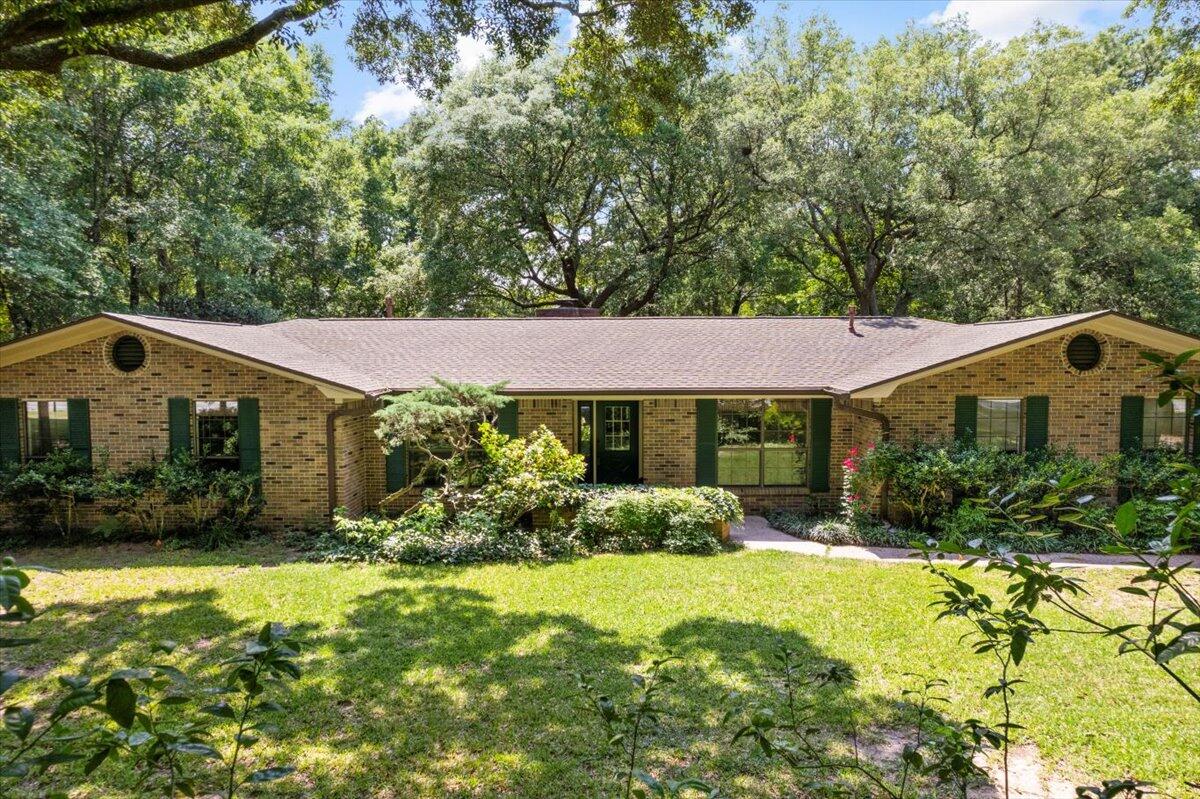 All-brick, Rocky Bayou Country Club Golf Course Estate home on 0.63 acres with a heated/cooled detached garage, perfect for woodworking and storing a golf cart. Quietly nestled on the 7th hole, this home features 4 bedrooms and 3 baths with one bedroom and bath off the kitchen to entertain guests. This well-maintained vintage home is perfect for entertaining, including two living areas (or an office), an eat-in kitchen, a sunroom and a separate dining room. The fourth bedroom is split off of the kitchen with a full bath for entertaining guests. Recent improvements include: Roof (2024), HVAC (2022), Septic (2021). Schedule your private showing and turn this into your perfect Niceville home!