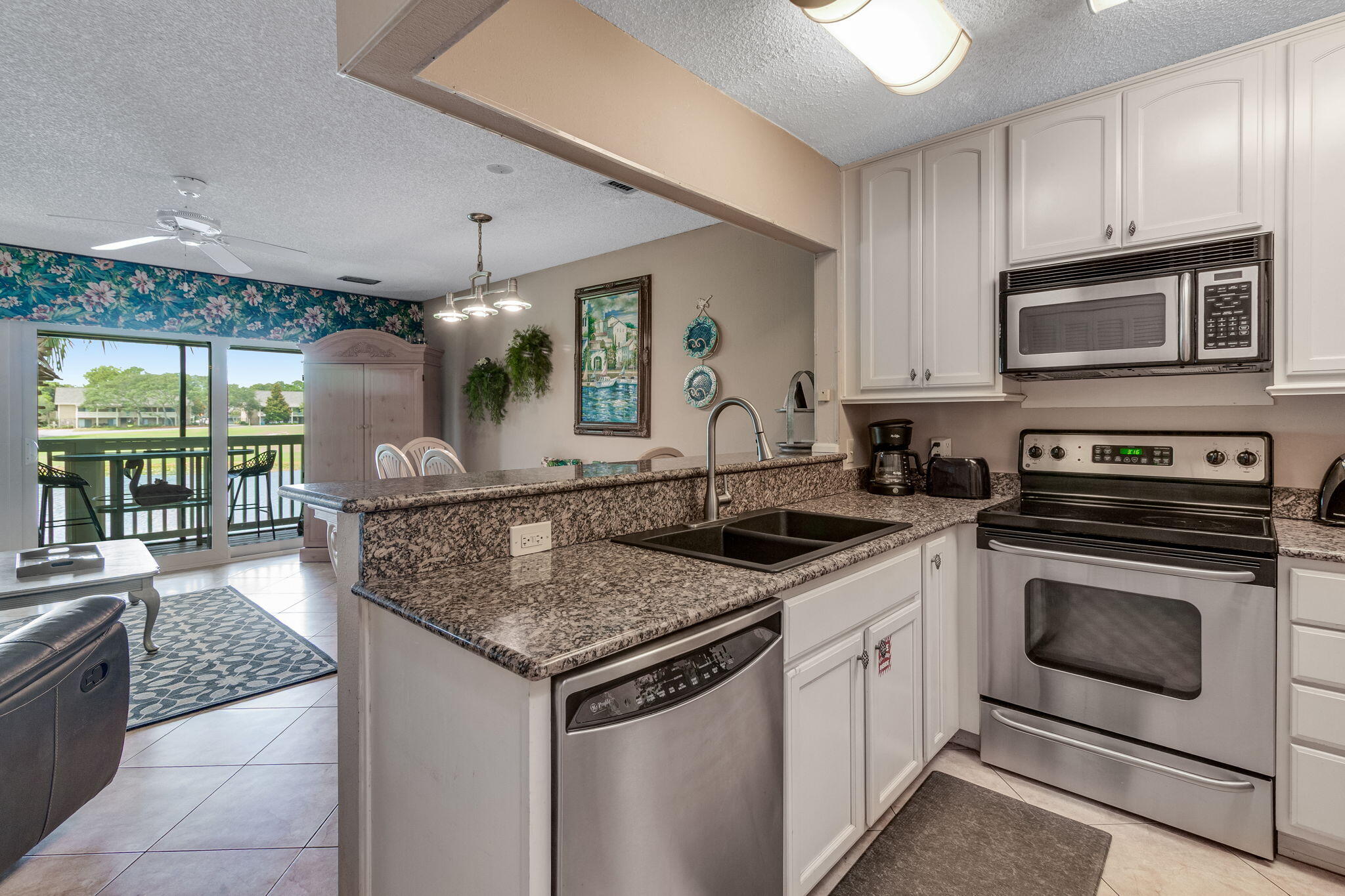 This beautiful 2 bedroom PLUS loft, making the condo live like a 3 bedroom, is perfectly placed within the Seascape Resort. 227 is within close proximity to the beach and just pool steps away from one of the swimming pools. The exterior of the building just went through a major upgrade including all new hurricane rated windows and doors, new balcony flooring, and 50-year Hardie-Plank siding, complying with new structural standards mandated by the state. This resort has something to offer for everyone, including six clay tennis courts, pickleball courts, five different pools (one heated), 18 hole golf course, and beach access. Other amenities include 2000 ft of beach with full-service beach set-up, water-sports, activities and Whale's Tail Bar and Grill. Whether you are looking for a prima ary home, second home, or rental, this is the place for you!