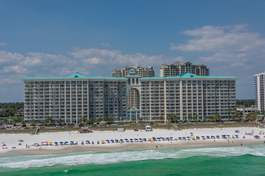 Unobstructed gulf views from the balcony of this stunning renovated 3 bedroom 3 bath end unit. Meticulously maintained and an impressive rental history make this a perfect choice for your second home. This unit generated 84K+ for 2023 with many repeat guest year after year.  Upgrades include porcelain tile floors throughout, new cabinetry with soft close doors, storage drawers and custom pantry, stainless appliances, designer furniture and custom window treatments.  Majestic Sun offers an indoor/outdoor heated pool for year round enjoyment, fitness room and hot tub. Seascape Resort offers 2000=/- feet of deeded beach access, 300+/- acres of lush landscaping, 18 hole public golf course, tennis, pools, dining & shopping without ever leaving the resort. Bookings must be honored by buyer.