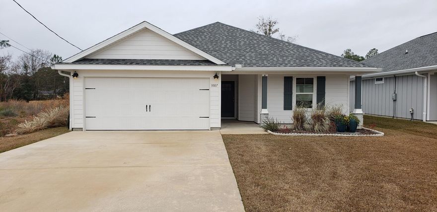 Location Location Location! Beautiful 2019 craftsman home 4 minutes from Navarre beach on oversized lot. Make this your home or VRBO investment or both, R2M zoned 10,019 sq ft lot with no HOA! Plenty of room for a 1000 sq ft guest cottage (engineer approved plans available) or a pool, garden, fruit orchard, etc! Meticulously maintained, better than new, cement siding, sprinkler system, privacy fence. Upgrades galore including: New soft close white shaker cabinets with custom Dolomite counters in kitchen and baths. Touch-less kitchen faucet. Upgraded Vinyl plank flooring by Coretec Plus in Blackstone Oak. High gloss 2 panel doors, 5'' trim and pewter hardware throughout home. Large master en-suite with huge walk-in closet. Plus extra large bonus closet so you don't have to share!