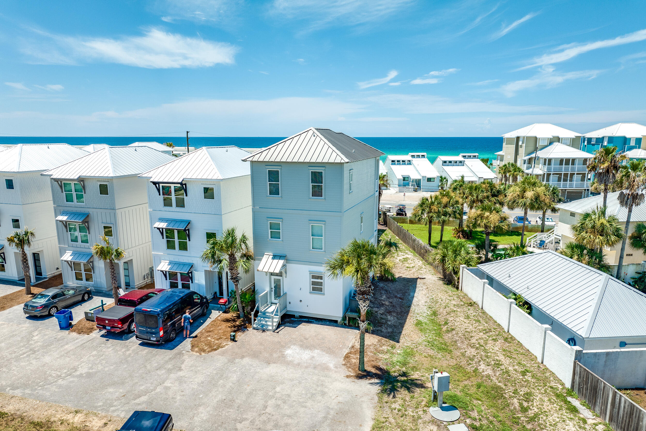 This inviting 4BR/2.5BA three-story beach retreat, newly renovated and perfectly positioned just steps away from Beach Access 95, offers the ultimate coastal getaway. Tastefully decorated and meticulously maintained, this residence holds great potential as a short-term rental investment or a second home. Recent updates, including vinyl plank flooring, a fresh interior/exterior coat of paint, and shiplap walls, enhance the home's charm. The first level features an open-concept layout, integrating the kitchen, living and dining areas, along with a convenient half bath. Upstairs, two bedrooms share a Jack and Jill bath, alongside a separate laundry room. The top floor comprises two more bedrooms, also sharing a Jack and Jill setup, with the added bonus of a balcony boasting gorgeous Gulf views. Tucked away at the end of a serene four-home development, this property provides increased privacy and enhanced vistas. Ideally located on Panama City Beach's west end, the home has easy access to Pier Park, Frank Brown Park, Aaron Bessant Park and other local attractions. 30A is just a short drive away. Don't miss out on the opportunity to see this beachside beauty firsthand. Contact us today for a private tour.