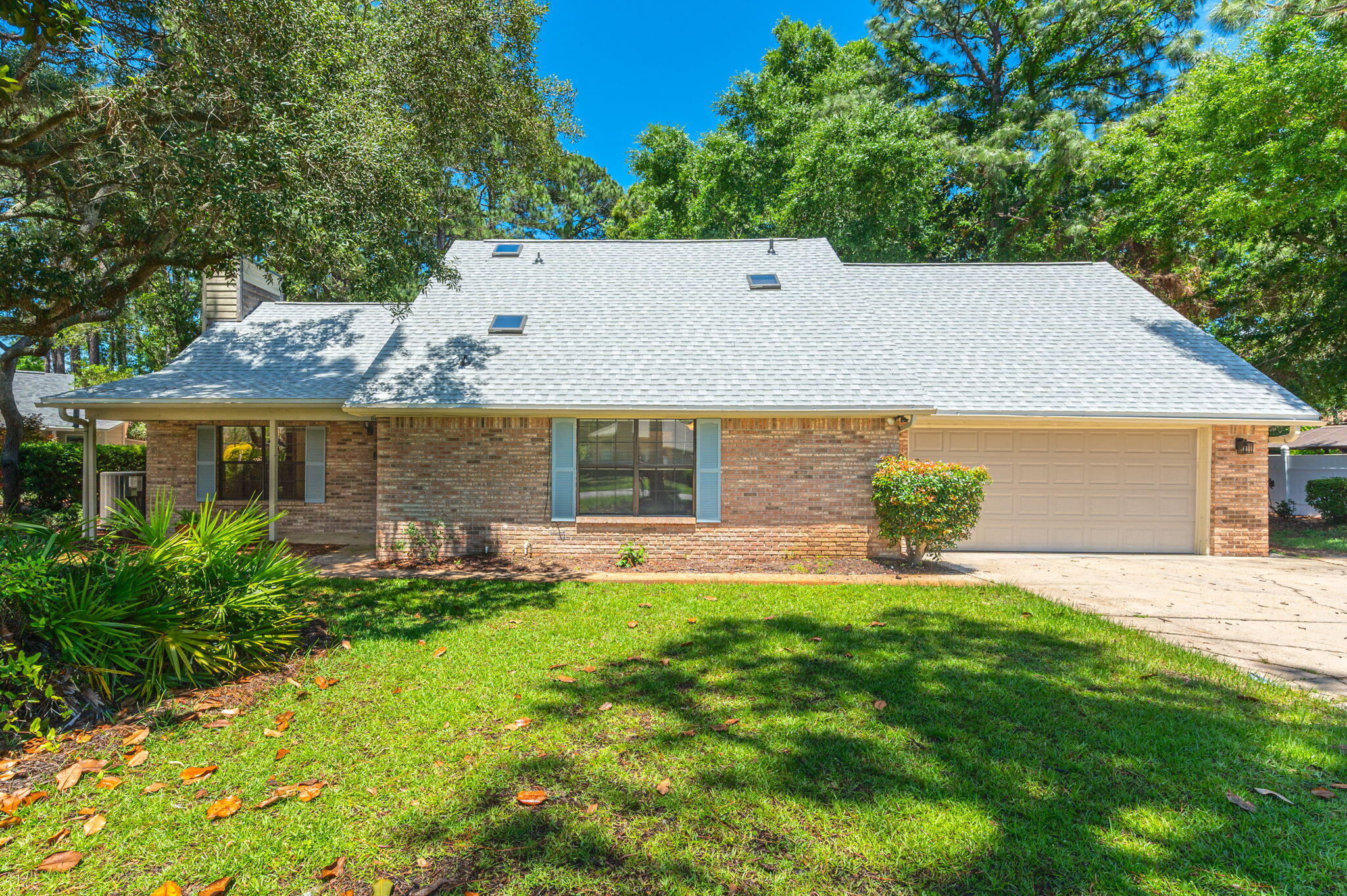 Come take a look at this charming home with a brand new roof! Located in Bluewater Bay and zoned to Bluewater Elementary and some of the highest rated schools in Florida, you'll love the mature landscaping, large lot and no HOA fees. The primary suite is located on the first floor and three additional bedrooms and a full bath are upstairs. Roof and hot water heater are 2025 and HVAC is 2024. Schedule your showing today!