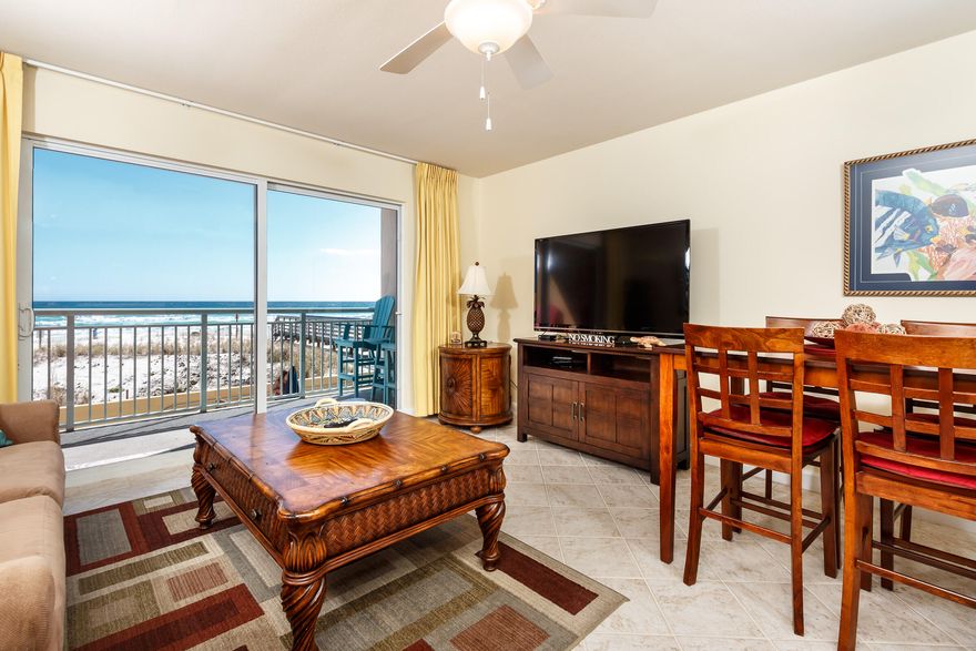 This unit has a second floor view as the first floor is covered parking!Pelican Isle 117 is a beautiful beachfront 1 bedroom condo with an ocean view. The private balcony faces the ocean (Gulf of Mexico). This condo comes complete with hallway bunk beds, full kitchen, 2 bathrooms, living and dining area, pullout sleeper sofa, cable TV, WiFi, and reserved parking. The balcony is equipped with chairs for a relaxing evening in the breeze. The scenery is complete with both a breathtaking view of the gulf and the sounds of the waves breaking on the beach.