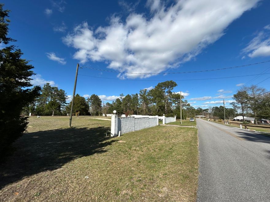 BUILD YOU DREAM RETREAT on 1.66 ACRES WITH EXISTING UTILITIES in Serene Ten Lake Estates.  Imagine building your custom home on this spacious and private 1.66-acre lot, just 10 minutes from charming downtown DeFuniak Springs. This property already has a power pole, city water, and a functional septic system--a major cost savings for any future build. A concrete driveway and privacy wall along the front and east side add to the value, offering a solid foundation to start your rural Florida lifestyle. The previous home was lost to fire, but that gives you a blank slate with essential infrastructure already in place. Nestled in a quiet setting with NO HOA, this is the perfect place for someone seeking space, privacy, and a slower pace of life. BRING YOUR BUILDER & VISION-Call Today!