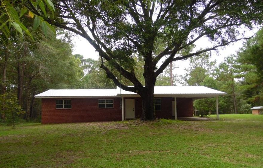 LOOK!!!! Brand new metal roof and new stainless steel appliances!!! Beautiful brick home on over 4 acres! Country living but close to town. Three bedrooms, two bathrooms, and a new kitchen which is open to the dining room. Home features both a family room and living room! You don't want to miss out on this gem! Gorgeously remodeled to include: new hardwood flooring, kitchen cabinets and countertops, new bathroom vanities, fixtures, and a new septic tank was installed. Seller will also provide a one year home warranty! Call today for your tour!