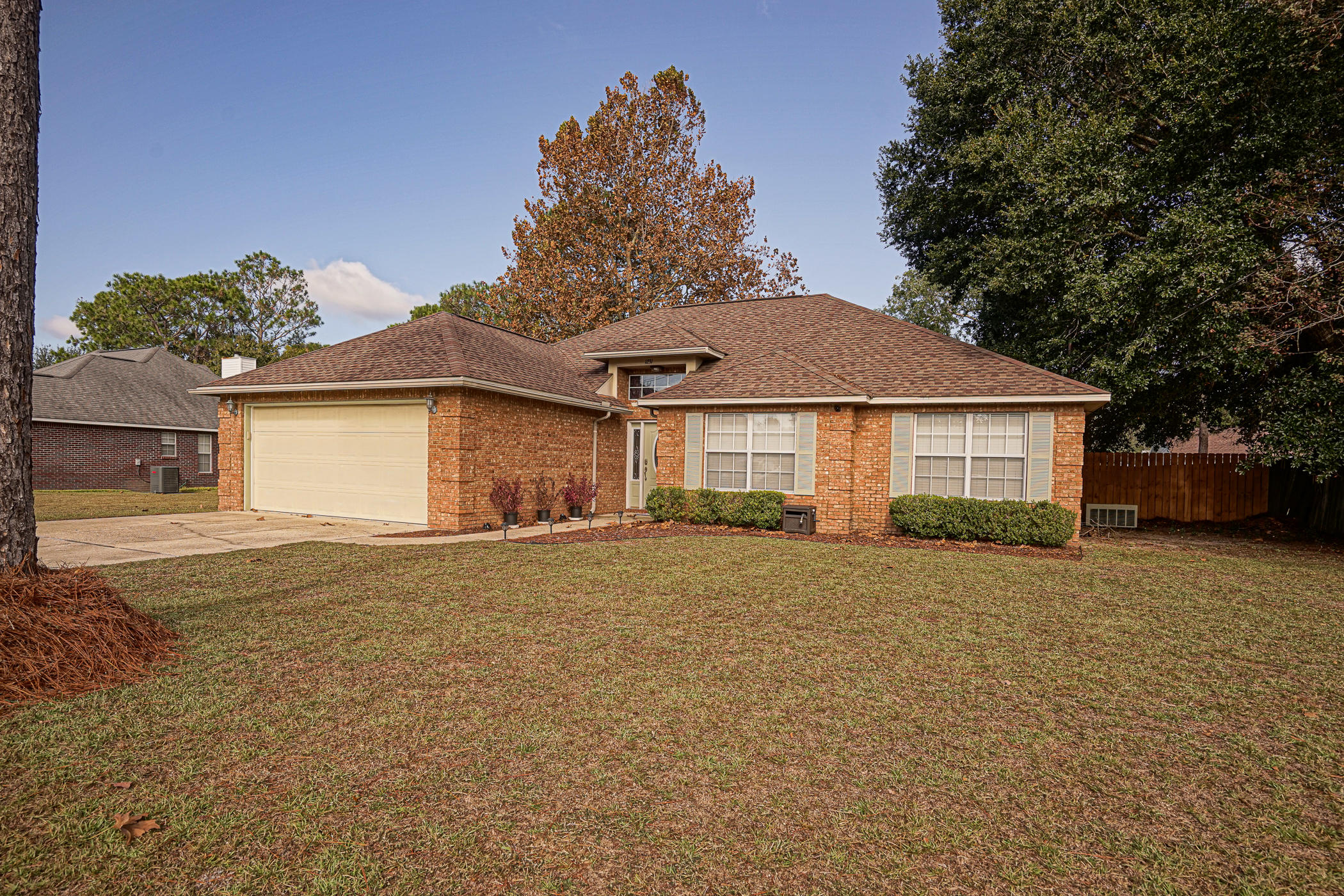 What a lovely home on a large lot with mature trees, South of I10, and without an HOA! Walk into the main entry into a small foyer with a large Formal Dining Room on the left. All common areas are carpeted and wet areas are tiled. Off the Formal Dining Room is a Flex Space currently used as a small office and an interior Laundry Room. Both of these rooms are adjacent to the Kitchen. Love to entertain? This Kitchen has plenty of cabinetry, a large pantry, and ample granite counter top space for your food preparation needs. Additionally, the Kitchen is equipped with all necessary appliances (including refrigerator). The Kitchen opens into the Great Room where you will find a charming, wood burning fire place and mantel, as well as, large windows and a trey ceiling for optimal lighting.