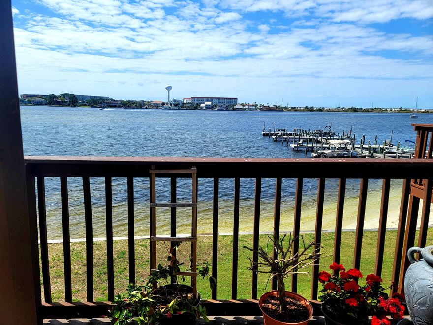 Welcome to your new ''Staycation''!! This waterfront condominium is offered completely furnished and move-in ready! You will revel in the glorious views from the living room, dining area and expanded private balcony. The south-facing position of this property ensures maximum light, and warmth from the sun. The light and bright main living area is open to the dining room and kitchen. The living room offers nice tile flooring, soft and light paint, lovely décor, a new ceiling fan, and a wonderful electric fireplace with temperature control which heats the entire Unit. Both comfortably sized bedrooms are lovely spaces to retreat, reflect and rejuvenate. Enjoy a modern updated bathroom with tile flooring, a walk-in tile shower, a new vanity with a granite countertop, new fixtures, and lighting. Step outside to an expanded private balcony and enjoy amazing sunrises and sunsets over the Santa Rosa Sound. This condominium is in the heart of our beautiful Emerald Coast, within two miles of the sugar white sands of the Gulf of Mexico. Highlights of this wonderful community includes a waterfront pool, a private fishing dock, a spacious clubhouse, on-site laundry area, lovely green/ground areas, tennis court, SUP/Kayak/Boat storage and boat slips (available on a first-come, first-serve basis). Owners may have pets. This complex is VA and FHA approved! Per HOA - No short-term rentals (30-day rental is allowed).