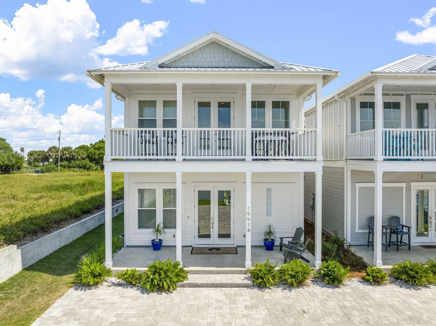Welcome to your dream beach retreat! This stunning 5BR/4.5BA home offers 2,800 SF of luxury living just steps from the sugar-white sands of Panama City Beach. Bright and airy with soaring ceilings and open-concept design, it features a chef's kitchen, refreshed coastal decor, and new artwork throughout. The living room and downstairs primary include brand-new area rugs for added warmth. Step outside to a private backyard oasis with a sparkling heated pool, wall-mounted TV, and app-controlled string lighting. A brand-new $10K patio set with loungers and balcony bistro table (lifetime warranty) elevates the outdoor living experience. Enjoy breathtaking Gulf views from the second-floor balcony. Additional updates include power-washed exterior (Aug 2025) and stylish new decor in the dining room and living room. Ideal as a full-time home, vacation retreat, or investment property with strong rental potential. Turnkey and beautifully maintaineddon't miss this West End gem on Front Beach Road!