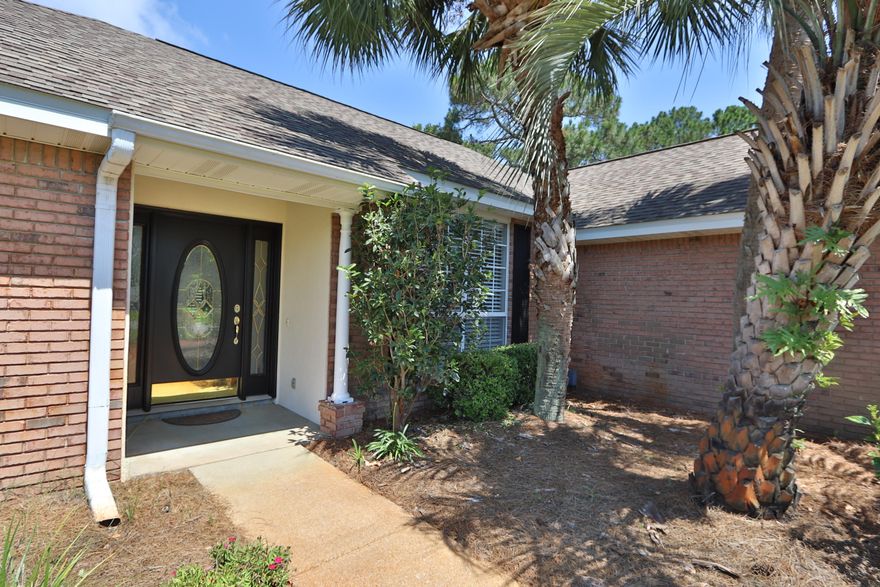 One owner custom 4 bedroom home in Destin. Built by Sweet Home Builders.This home has been well cared for and upgraded! Located in Eagles Landing subdivision a quaint sought after neighborhood with community pool and picnic pavilion. Great location just across the street from the pool area too. This home features a split bedroom plan and large 2 car garage with side service entry door. All new flooring through out the home. Freshly painted interior. Living room features tray ceiling with crown molding. Gas fireplace with 1x1 slate mosaic surround. built in cabinet with granite, custom shelves and glass audio cabinet. Great room for relaxing and entertaining as the french doors lead to the privacy fenced back yard. Kitchen features all stainless Samsung appliance package Beautiful Carerra Herringbone marble mosaic backsplash, breakfast nook overlooking the yard. Masterbedroom features tray ceiling, crown molding, walk in closet, double vanity, water closet, 12x24 porcelain tile floors ans shower walls, walk in shower with glass mosaic accent band and frameless glass door. Guest bath renovated too and has new glass enclosure. New roof in 2015, new gas water heater in 2014, new Samsung appliances ion 2016, all new updated light fixtures in 2016. No carpet in the home and all new Luxury Vinyl Plank Hard Surface flooring Whitfield Grey in 2019. This home was built as a 3 Bedroom with a formal dining area. Seller changed dining area into a full bedroom. Could be converted back? Opened back up to living area? Such a cute home in great condition! Wow this home is ready to move in and enjoy life!