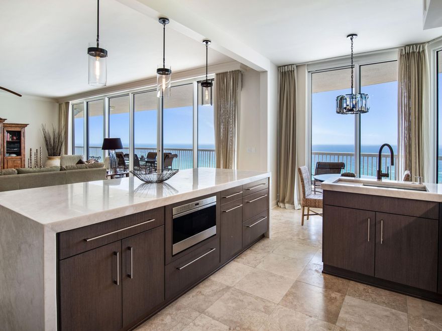 Enjoy incredible beachfront living and world-class amenities at the luxurious St. Thomas at Silver Shells Beach Resort in sought after Destin, FL. Amazing unobstructed views of the Gulf of Mexico, with a generous 80-foot wide balcony and luxurious features throughout, here is a one of a kind 3 bedroom, 3.5 bath condominium capturing the ultimate in relaxed sophistication that embodies the Florida lifestyle. The excellence begins from the moment you walk inside this 2,918 square foot retreat. With travertine flooring in the principal living areas, the spacious floor plan has high ceilings and floor to ceiling windows bringing in plenty of natural light. The large great room comes complete with wet bar, and dining area that can be closed off for privacy.