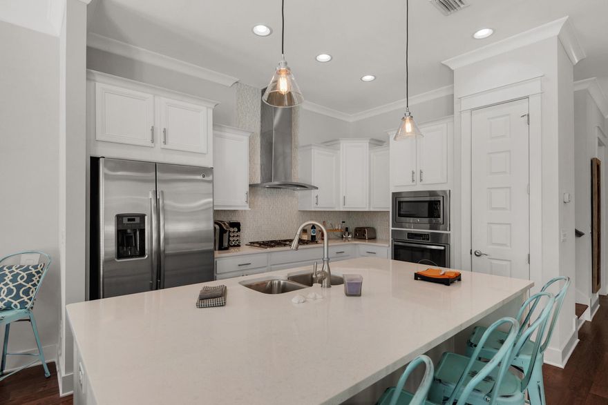This charming townhome offers a modern and simple sophistication to the quaint beach lifestyle. Located in the Prominence community, this complex is one of the most unique developments in the area with a 3-Acre town center and luxury amenities available to all its residents. Some of the adorning features in this home include a rich hardwood flooring throughout, 10-ft raised ceilings, granite countertops, a beautifully appointed open kitchen with a breakfast bar and stainless steel GE appliances. This bright and open floor plan offers over 1,700 square feet of living space, 3 bedrooms and 2.5 bathrooms. Residents will enjoy access to resort style pool, a fitness center and a complimentary private shuttle service during the summer to the public beach access.