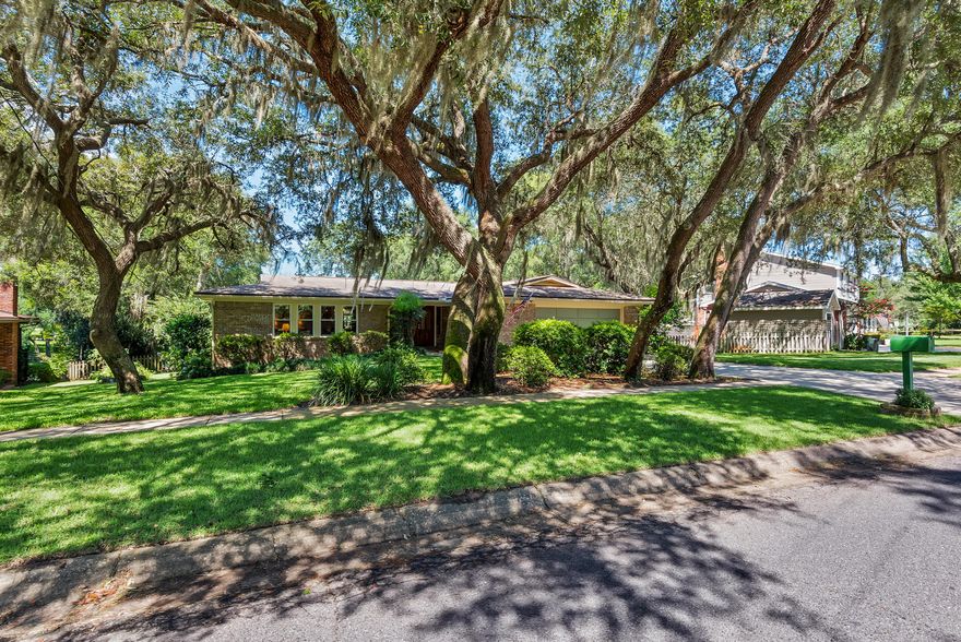 LAKEFRONT REMARKABLE HOME!! Situated on almost 1/2 acre this 3 bedroom, 2 bath, one-story home on Bass lake located in the sought-after Kenwood area. Ultimate Gardner's yard with blackberries, raspberry and blueberry bushes, peach and Meyer lemon trees and a kitchen-herb garden. Well pump runs the sprinkler system to ensure landscaping stays green and beautiful. Entire backyard is fenced with small dock to access the lake. Non-motorized boats allowed for plenty of lake fun! Perfect home for entertaining family or just day-to-day living! The open layout offers bamboo flooring throughout the entire home with the exception of the foyer and bathrooms which are porcelain tile. So many upgrades to name a few: Cased windows with wide sills, crown molding, tankless water heater, new windows,