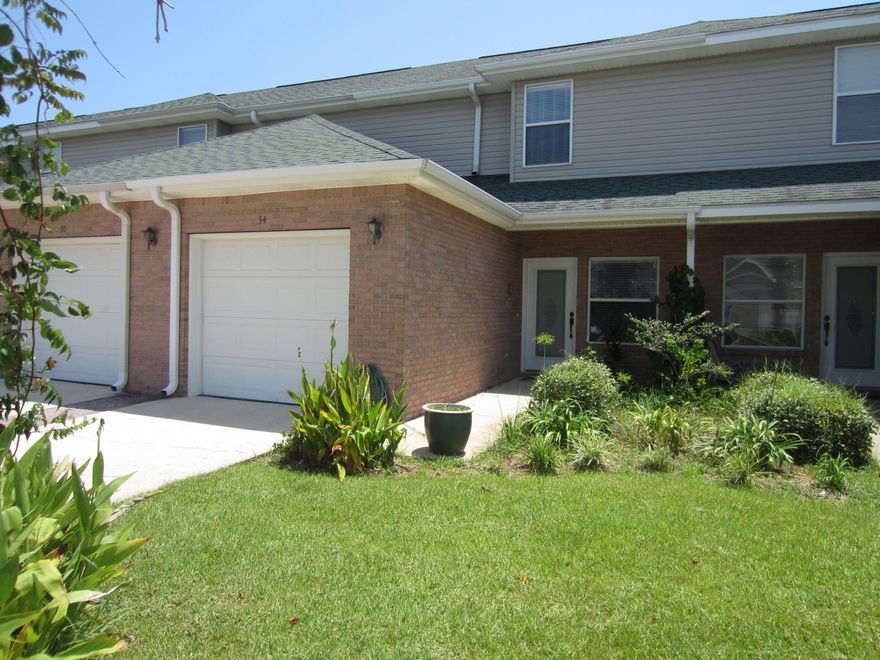 JUST REDUCED! Well maintained townhome right in the heart of Destin in the Magnolia Park neighborhood. The downstairs consist of a good sized family room, kitchen, dining area, half bath and laundry. The glass sliding doors open to a private patio and fenced back yard. Both bedrooms upstairs are good size and each has their own bathroom and walk-in closet. This home also has a 1 car garage. The neighborhood is conveniently located to the Destin Harbor, churches, Destin Elementary and much more. This will make for a good starter home or investment property. You need to come see it.
