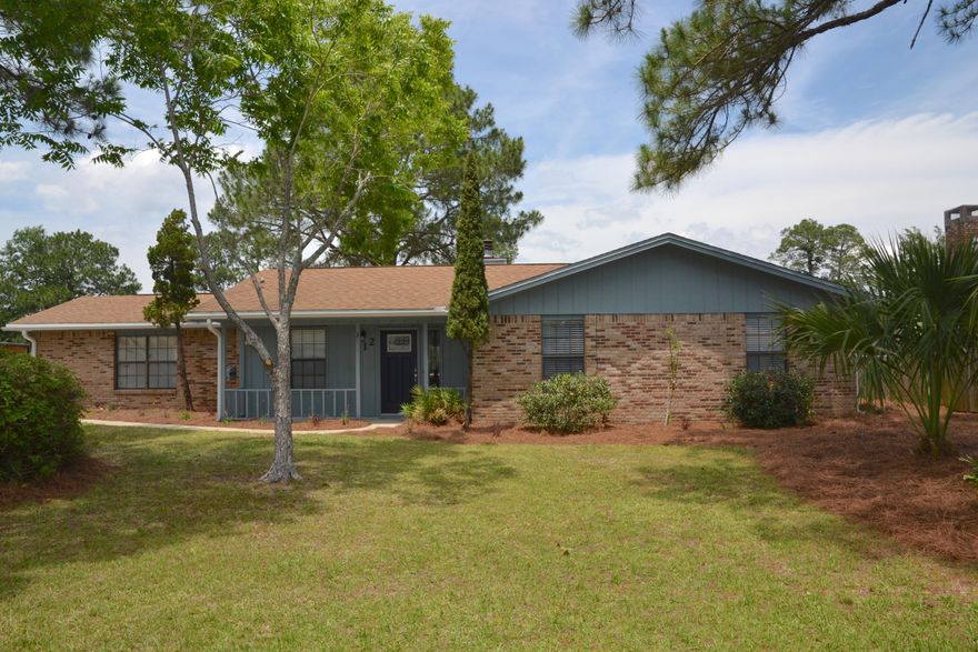 Located in the Heart of Niceville off of Bayshore Drive in Palm Estates! UPDATED 3 Bedroom, 2 Bathroom home situated on a CORNER lot w/a fenced backyard, Screened Porch, and 2 car garage! NEW: flooring, fixtures, hardware, appliances, exterior doors, fresh paint and much more! Front Porch Entry has a Craftsman style door opening up to the Foyer and LARGE Living Room anchored by the Stone wood-burning Fireplace! Continue into the Dining Room w/a Bay Window and view of the Back Yard. Kitchen is equipped w/Breakfast bar, lots of cabinets and a PANTRY! From the Living Room step out to the 18x10 Screened Porch w/ceiling fan to enjoy your OUTDOOR SPACE and get Creative to make it yours w/a FIRE PIT; plus plenty of space to park your boat! VIEW TODAY! 1 YR AHS Home Warranty, $400 Value.