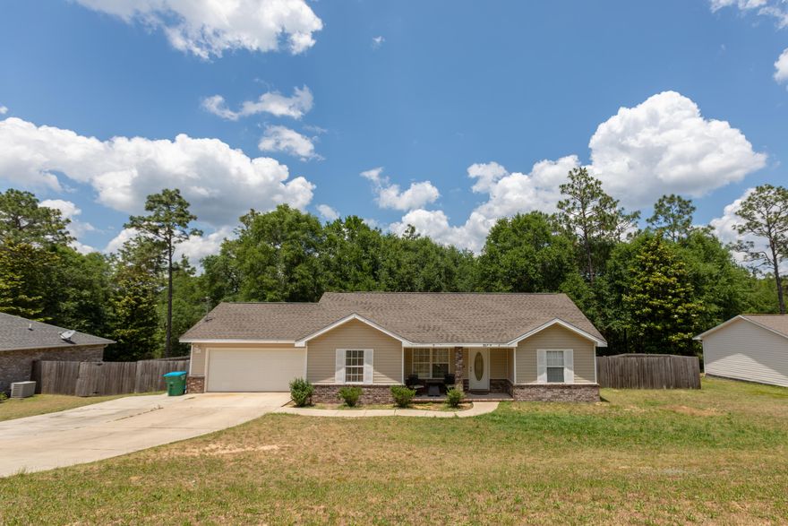 Beautiful home in the heart of Crestview. This home is located on a quiet street. 3/2 floor plan with wood laminate flooring in the living room. Tile in the kitchen with black appliance package. Eat-in kitchen area and large laundry room. Trayed ceilings in all bedrooms. Large baths and 2 car garage. Additional parking for multiple vehicles, a boat, or camper. HUGE privacy fenced back yard with a fire pit and large open patio with double gates for entrance. Vivant smart home capability.