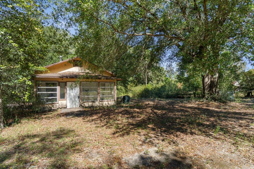 Welcome to a serene 4-acre retreat with endless potential! Located conveniently on Hwy 90, this property offers the perfect blend of rural charm and accessibility, with nearby access to Defuniak Springs and Crestview. Nestled on this expansive parcel, you'll find a 2-bedroom home awaiting your vision, accompanied by two sheds and an animal shelter that could potentially serve as a horse stall. The property also boasts a spring-fed pond, ideal for relaxation and recreation, and comes equipped with essential utilities, including a well, septic tank, and electricity. In addition, you'll discover existing fencing and cross-fencing in place, adding to the property's functionality. Zoned for General Agriculture, this property is a canvas for your dreams. Whether you're looking to renovate