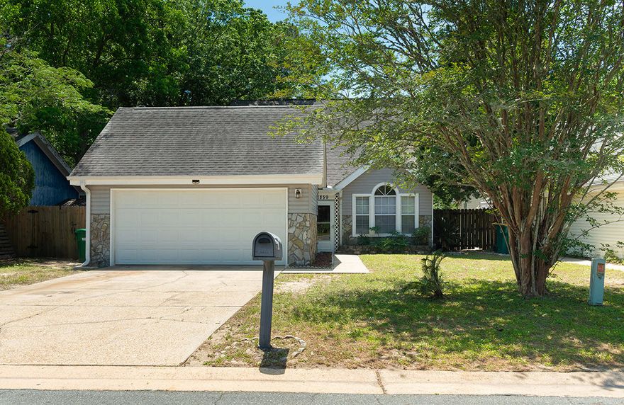 All new interior paint and new flooring throughout! Open floor plan with a spacious kitchen and raised hearth stone fireplace, separate formal dining room, master suite with large master bath, second bedroom downstairs and third bedroom upstairs. This home also has a two car garage, a screened porch, a patio and a privacy fenced back yard.