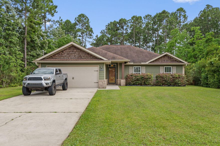 Welcome to this beautifully designed Craftsman-style retreat nestled on a generous 1/2-acre lot, just minutes from the beach! This 4-bedroom, 2-bath home offers the perfect blend of comfort, function, and style with an open floor plan, soaring 10' ceilings, recessed lighting, and durable LVP flooring throughout the main living area. The heart of the home features a spacious kitchen with granite countertops, stainless steel appliances (including a refrigerator), a convenient center island with hop-up breakfast bar, and plenty of room to entertain. The private primary suite is a true escape--complete with a cozy sitting area and direct access to the expansive screened lanai, perfect for morning coffee or evening relaxation. The en-suite bath boasts a large tiled walk-in shower, dual vanities with sleek quartz counters, and ample storage. You'll love the oversized laundry room, fenced backyard, and paid-off solar panels that offer energy efficiency without the extra cost. Located on a quiet street just a short drive to shopping, dining, and the sugar-white sands of the Gulfthis home truly has it all. Don't miss your chance to own your slice of paradiseschedule your tour today!