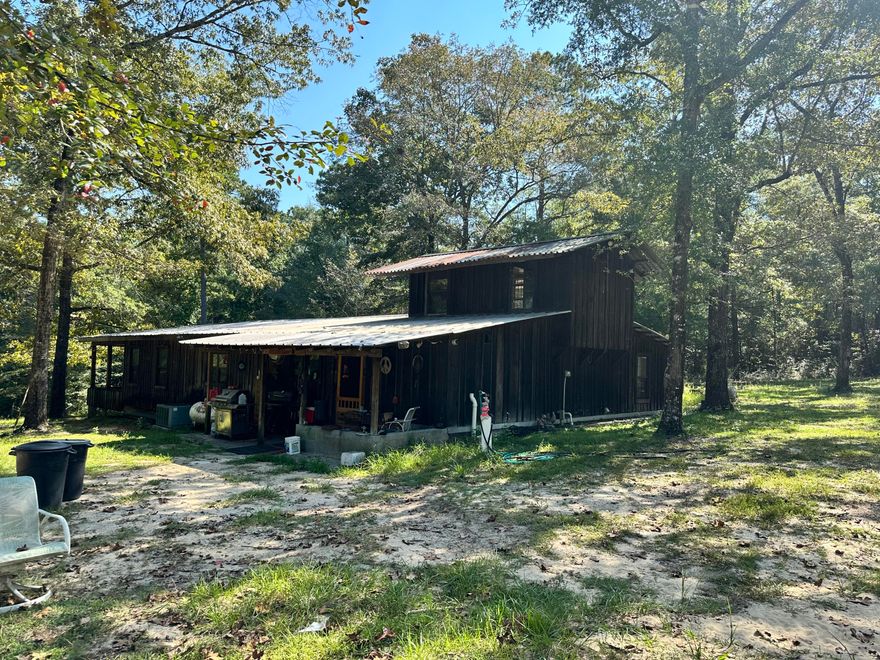 PRICE IMPROVEMENT!!! Come take a look at this OPPORTUNITY! This home is on 48 acres plus a mobile home on the property that can be used or rented. The property has virgin timber, multiple spring heads, possible 5-6 pond sites. Farm equipment to convey. You are 35 minutes to Panama City Beach and 40 minutes to Destin. Don't miss out on this beautiful property!