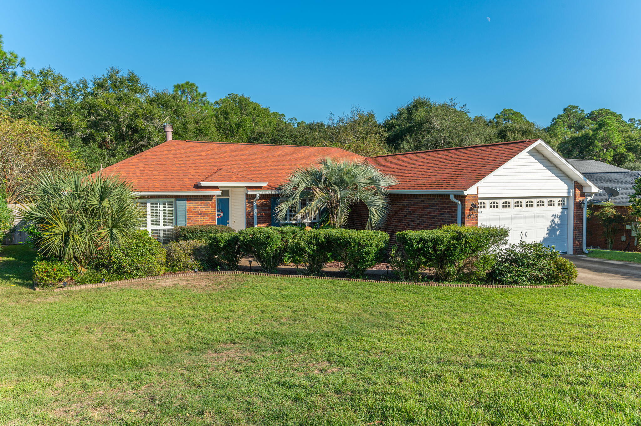 all brick home that features 3BR/2BA, 2 car garage, a whole yard sprinkler system, 2017 a/c with air purification added in 2021,  Roof 2021, water heater 2024, split floor plan layout featuring vinyl plank flooring in main areas, carpeted bedrooms, fireplace, plantation shutters in kitchen & front bedroom, tiled backsplash with breakfast bar & pantry in the kitchen, beautiful custom built-in seating with storage in the eat-in dining area. The backyard features a 12x12 screened in porch, brick paved open patio, fire pit, and fully fenced (replaced in 2021) HUGE backyard with tons of privacy. Zoned county = lower taxes! Survey is available. Appliances and washer & dryer convey! Ready to move in and enjoy right away. ASSUMABLE VA RATE AVAILABLE!!!