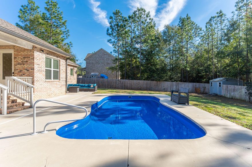 SELLERS WILL CONTRIBUTE UP TO $10,000 TOWARD BUYER'S CLOSING COSTS!!! Check out this beautiful 4-bedroom, 2-bath home located on a large lot in the highly sought-after Mill Creek Farms subdivision. From the moment you arrive, you'll notice the attention to detail throughout this immaculately maintained Randy Wise home. Features include 8' doors, crown molding, stainless steel appliances, granite countertops and covered front/back porches. The open-concept living area is perfect for entertaining and is complemented by a versatile flex room ideal for a home office, playroom, or formal dining space. The private owner's suite is thoughtfully separated from the three additional bedrooms. Luxury vinyl plank flooring runs throughout most of the home w/ carpet only in the primary bedroom and tile in both bathrooms. Step outside to enjoy your own backyard oasis complete w/ a sparkling heated swimming pool installed in 2023. The spacious, fully fenced backyard features a double gate, a deep lot that extends beyond the fence line, and a yard building for additional storage. Other notable features include a side load garage and irrigation system. This home offers comfort, style, and space inside and out and is a must-see in Mill Creek Farms. Buyer to verify and satisfy themselves to all areas of importance. The TVs left in the home will convey (there are a total of four). 