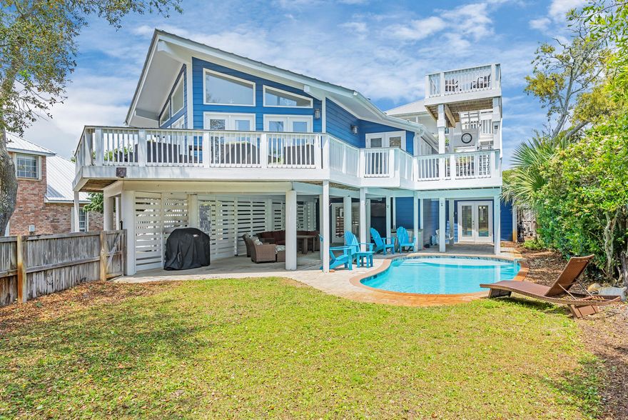 With an air of mid-century style, this charming South of 30A beach retreat offers privacy on a large lot, only moments from the Gulfview Heights Regional Beach Access. This property provides plenty of space for large groups to spread across--with 5 bedrooms, 4 bathrooms, two living areas, a second-floor deck that runs along the architecture of the home and leads to a crow's nest deck with a glimpse of the Gulf, and two fenced-in yards. One area is privatized in the front, surrounding the heated pool, the other is out back, with a patio-sitting area. Beautiful live oaks offer a parklike atmosphere in front. Indoors, enjoy an open living, dining and kitchen area with a vaulted ceiling and walls of windows. Downstairs is the second master suite and recreation room with pool table and wet bar. The home has two sizeable outdoor storage lockouts for beach gear; one is a small garage. With the large bunk room, this home can accommodate groups of up to 14.

At the end of Betty Street, turn left to enjoy the Gulfview Heights Beach Access, providing parking, restrooms, showers, sheltered picnic tables, and lifeguards during peak season. 95 Betty St is approximately 350 yards to the sand.

Betty Street offers privacy away from it all, with just 28 homes on large parcels and a dead-end, there will be limited drive-through traffic.

No HOA fees or added restrictions means freedom of ownership and opportunity for creative growth and expansion.

The home is just under 3/4 a mile to the shops and restaurants at the intersection of 393 and 30A, including, Papa Surf Burger Bar, Shunk Gulley, Growler's Garage (Craft Beer), Pecan Jack's Ice Cream, The Perfect Pig and other Gulf Place amenities. 

If you are looking for a South of 30A beach home with character and an incredible, private location, 95 Betty Street belongs on your list of must-see properties.

