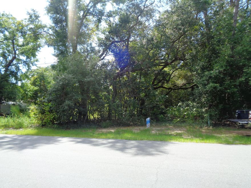 Located just west of Bluewater Bay, this parcel is zoned R-1 with a density of 4 to 5 homes. Size of parcel includes an easement to adjoining property that could be used to subdivide the parcel. Public utilities are available with tap fees due. Easy access to Destin and Niceville plus shopping.