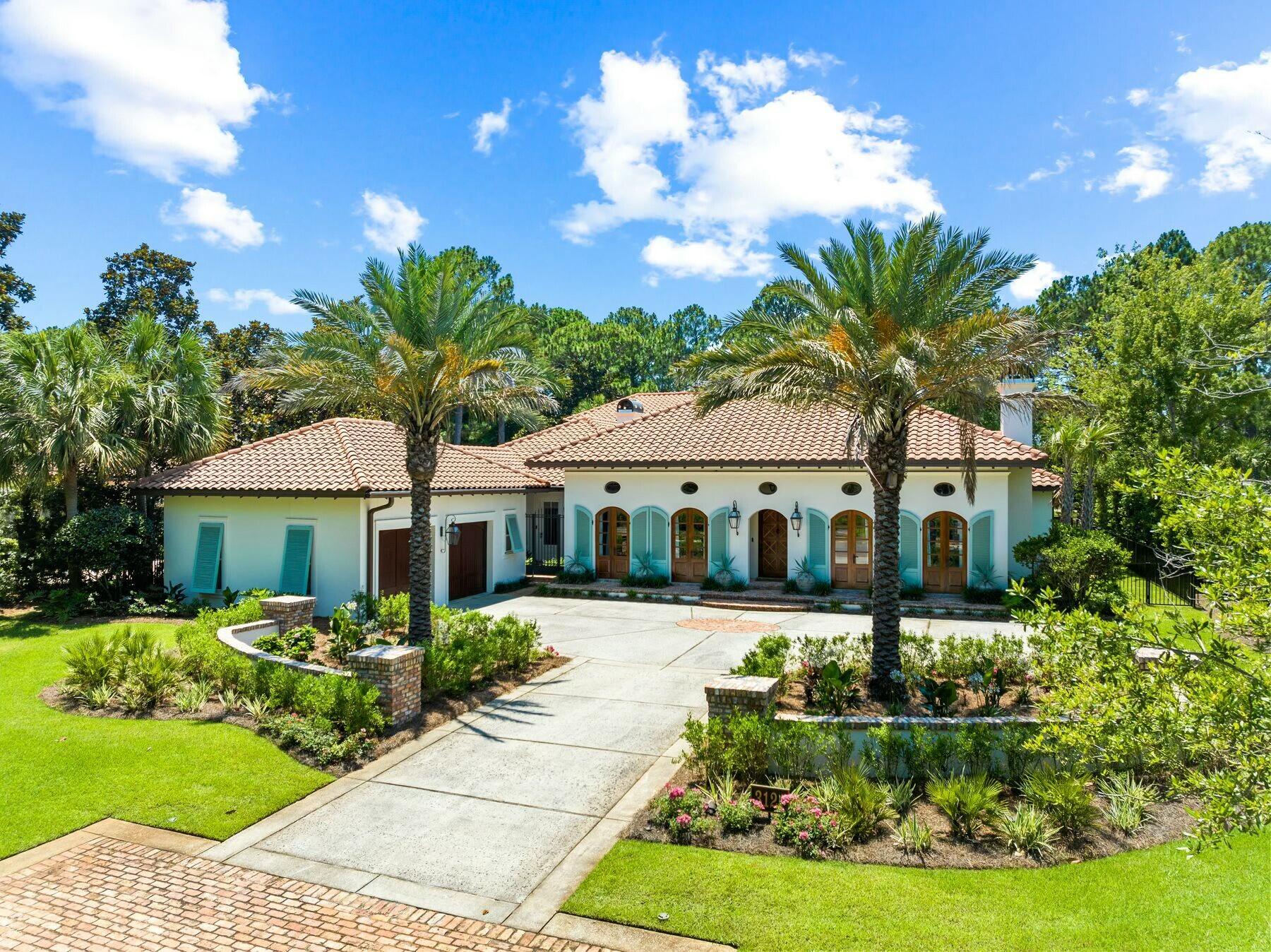 Located in the prestigious non-rental community of Burnt Pine, this completely remodeled home enjoys exceptional privacy. Meticulously maintained and lightly used as a second home, this Mediterranean-style residence is surrounded by mature trees and backs up to the 11th fairway of the golf course. A two-car garage and a row of shuttered windows announce the covered entrance. Step inside and enter a seamless, sophisticated world where custom cabinetry and modern technology enhance the stunning floor plan. Designed for functionality and entertaining, the gracious formal dining room and living room boast custom chandeliers, a fireplace, crown molding and many extras. The custom-built bar has an integrated Sub-Zero wine cooler and is perfect for amateur mixologists to create and serve signature cocktails. Professional decor in muted tones complements the marble and hardwood flooring. The home showcases the Ferrari of kitchens with custom cabinets, high-end Wolf and Sub-Zero appliances and a walk-in butler's pantry, all designed to make entertaining easy. Two dishwashers, an under-counter beverage refrigerator, a six-burner gas stove, a double range, an ice maker and an integrated coffee station are just some of the refinements surrounding the marble-topped island. Retire to the exquisite master bedroom, which has custom cabinetry incorporating a Brown safe. The adjoining luxurious bathroom has a deep garden tub, dual vanities and an enhanced steam shower. In addition to the master bedroom being on the first level, there is a luxury guest suite wing as well that has its own built-in refreshment center. The other two bedrooms are located on the second level; each with their own ensuite baths and private balconies. The rear courtyard wraps around a large pool and water features, overlooked by three screened porches on two levels. There's ample space for alfresco dining and relaxing in the peaceful park-like setting. A covered porch houses the outdoor kitchen, complete with a Wolf gas grill at one end and a cozy fireplace at the other. An outdoor TV and audio system make this a year-round place to enjoy. The whole house has an ultra-smart home configuration with true remote operation, allowing owners to monitor audio, video, lighting and shade control onsite or from afar. Additional upgrades include LED Lutron lighting, HighSEER air-conditioning systems, dehumidifiers, tankless hot water, an electronic door-locking system, cameras, water filtration and a water pressure booster. The upgraded landscaping includes perimeter fencing, irrigation and lighting. Surrounded by a new travertine deck, the pool has new pumps, filters and a heater. With endless golf, watersports, a marina, boutique shopping and high-end dining nearby, this Sandestin home has it all.